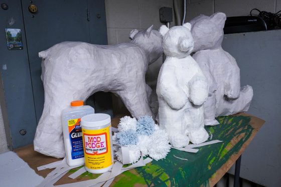 Three paper mache bear figures.